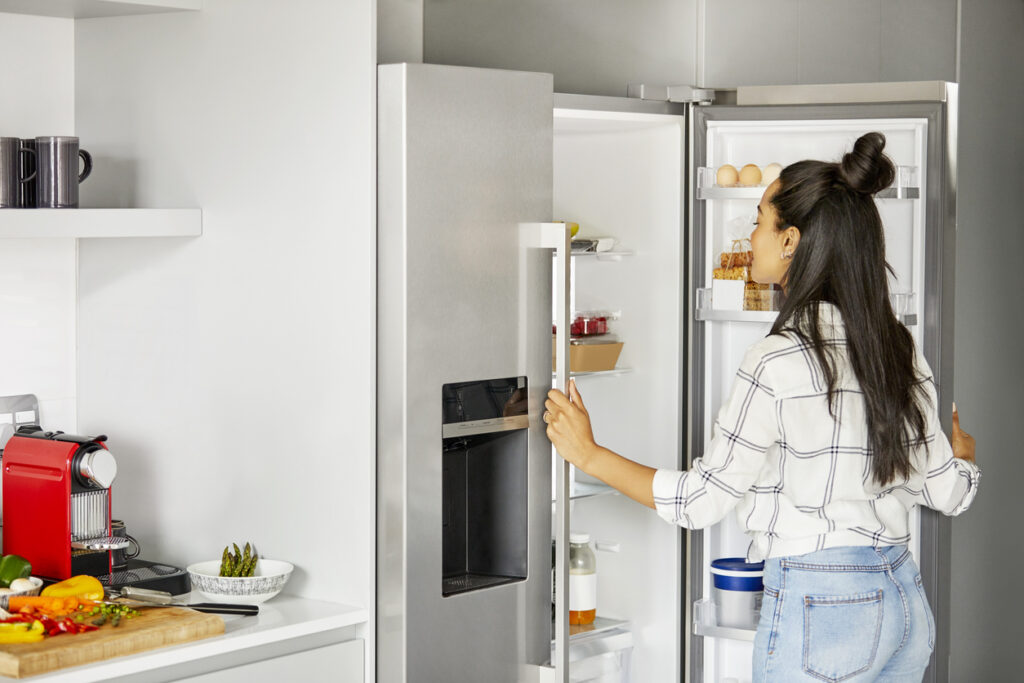 woman looking in the refrigerator in kitchen