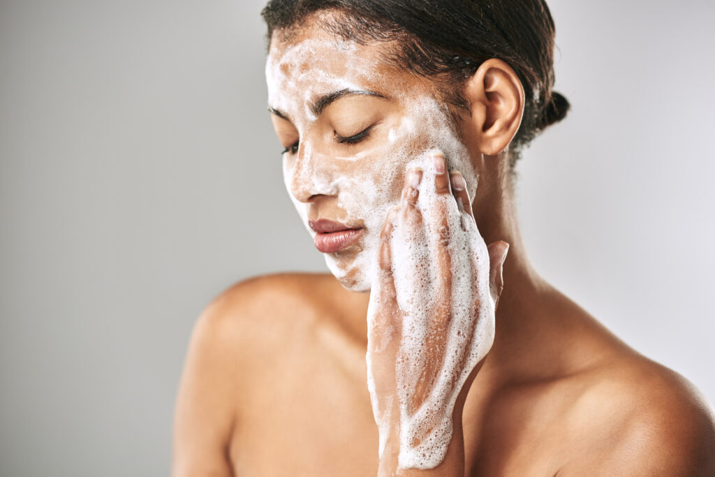 close-up-of-woman-washing-face-after-chemical-peel